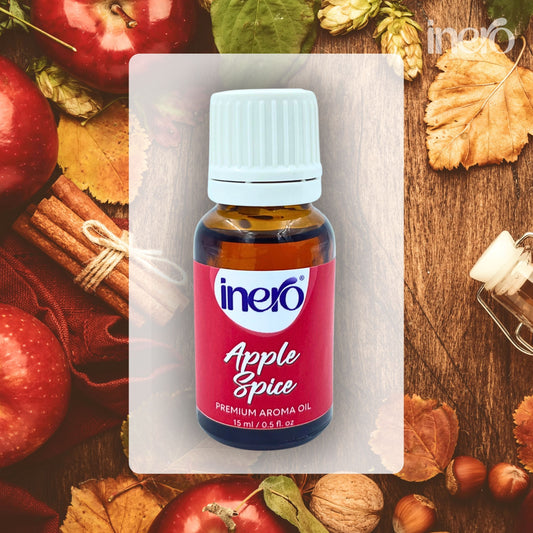 Bottle of inero Apple Spice aroma oil with autumn-themed background